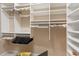 Walk-in closet with extensive shelving and hanging rods for optimal organization at 133 Torino Ln, Kissimmee, FL 34759