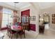 Formal dining room showcasing a chandelier, large window, and buffet at 133 Torino Ln, Kissimmee, FL 34759