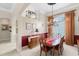 Dining room featuring elegant chandelier, wainscoting, and buffet at 133 Torino Ln, Kissimmee, FL 34759