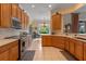 Bright eat-in kitchen with stone countertops, stainless steel appliances, and tile flooring at 133 Torino Ln, Kissimmee, FL 34759