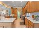 Contemporary kitchen featuring stone countertops, stainless steel appliances, and ample cabinet space at 133 Torino Ln, Kissimmee, FL 34759