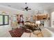 Inviting living room with open layout, view into dining area, and neutral paint at 133 Torino Ln, Kissimmee, FL 34759