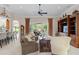 Open living space offering tile floors, sliding glass doors, and access to kitchen at 133 Torino Ln, Kissimmee, FL 34759