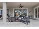 Covered patio features a ceiling fan and plenty of comfortable seating, creating a relaxing outdoor space at 133 Torino Ln, Kissimmee, FL 34759