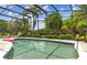 Beautiful screened-in pool area with lush greenery providing privacy and shade at 133 Torino Ln, Kissimmee, FL 34759