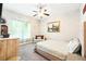 Bright bedroom with large windows, a comfortable bed and neutral decor at 1411 Celebration Ave # 106, Celebration, FL 34747