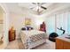 Cozy bedroom with a unique ceiling fan, comfortable bed, and playful decor at 1411 Celebration Ave # 106, Celebration, FL 34747