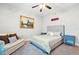 Comfortable bedroom with a soft bed, neutral decor and ceiling fan at 1411 Celebration Ave # 106, Celebration, FL 34747