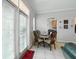 Cozy breakfast nook featuring a round table, comfortable chairs, and natural light from a nearby window at 1411 Celebration Ave # 106, Celebration, FL 34747