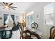 Cozy dining area is adjacent to the living room and offers comfortable seating and natural light at 1411 Celebration Ave # 106, Celebration, FL 34747