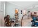 Quaint dining area featuring a round table, elegant chairs, and a view of the kitchen at 1411 Celebration Ave # 106, Celebration, FL 34747