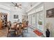 Bright dining room with tray ceiling, wood floors, and french doors leading to the outdoor at 1411 Celebration Ave # 106, Celebration, FL 34747