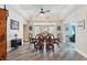 Bright dining room with tray ceiling, wood floors, and a lovely view of the outdoors at 1411 Celebration Ave # 106, Celebration, FL 34747