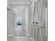 Welcoming entryway with wood-look floors and a decorative barn door at 1411 Celebration Ave # 106, Celebration, FL 34747