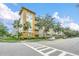 Lovely condo complex with well-maintained landscaping and sidewalks for walking and enjoying the outdoors at 1411 Celebration Ave # 106, Celebration, FL 34747