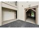 Garage entrance providing covered parking, plus an additional doorway and covered area for entering the building at 1411 Celebration Ave # 106, Celebration, FL 34747