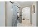 Stylish foyer with sliding barn doors and an arched doorway leading to another room at 1411 Celebration Ave # 106, Celebration, FL 34747