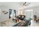 Comfortable living room with plush leather seating, soft rug, and natural light at 1411 Celebration Ave # 106, Celebration, FL 34747