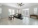 Bright living room with tile flooring, ceiling fan and plenty of windows at 1411 Celebration Ave # 106, Celebration, FL 34747