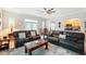 Relaxing living room with comfortable seating, area rug, and views into the kitchen and dining area at 1411 Celebration Ave # 106, Celebration, FL 34747