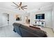 Comfortable living room with a TV and stylish furniture, offering an open view to the kitchen at 1411 Celebration Ave # 106, Celebration, FL 34747