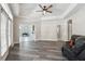 Open living room with wood flooring, bathed in natural light from large windows, creating an inviting atmosphere at 1411 Celebration Ave # 106, Celebration, FL 34747