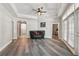 Open living room with hardwood floors and natural lighting at 1411 Celebration Ave # 106, Celebration, FL 34747