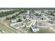 Aerial view showcasing a community with lush landscaping and a pin highlighting the property's location at 145 Willow Dr, Poinciana, FL 34759
