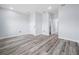 Spacious bedroom with multiple doorways, neutral paint, hardwood flooring, and natural light at 145 Willow Dr, Poinciana, FL 34759