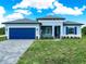 A lovely home with a blue exterior, complemented by a well-maintained lawn and inviting curb appeal at 145 Willow Dr, Poinciana, FL 34759
