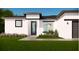 Beautiful new construction home with a modern design, manicured lawn, and beautiful landscaping at 16837 Sw 47Th Court Rd Rd, Ocala, FL 34473