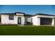 Beautiful new construction home with a modern design, manicured lawn, and beautiful landscaping at 16837 Sw 47Th Court Rd Rd, Ocala, FL 34473
