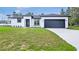 Charming single-story home featuring modern design and well-maintained landscaping at 16837 Sw 47Th Court Rd Rd, Ocala, FL 34473