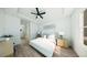 Calm primary bedroom featuring neutral colors, wood floors, and a modern ceiling fan for comfortable living at 16837 Sw 47Th Court Rd Rd, Ocala, FL 34473