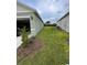 A lush green backyard provides ample outdoor space between the main house and the guest house at 1791 Post Oak Dr, Davenport, FL 33837