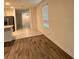 An open floorplan that features vinyl plank flooring and abundant natural light at 1791 Post Oak Dr, Davenport, FL 33837