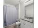 Bathroom featuring shower/tub combo, toilet, and vanity with granite countertop at 1809 Bluepoint St, St Cloud, FL 34771