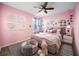 Bright bedroom with whimsical décor, plush rug, and comfortable furnishings at 1809 Bluepoint St, St Cloud, FL 34771