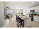 This open-concept kitchen features granite countertops and opens to the living room and dining area at 1809 Bluepoint St, St Cloud, FL 34771