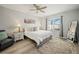 Serene main bedroom with a large window, plush carpet, and soft lighting, creating a peaceful retreat at 1809 Bluepoint St, St Cloud, FL 34771