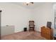 A bedroom offers carpet flooring and natural light through a window at 1825 Pelican Hill Way, Kissimmee, FL 34759