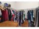 Spacious walk-in closet with ample hanging storage and built-in shelving for organized clothing and accessories at 1825 Pelican Hill Way, Kissimmee, FL 34759