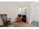 A cozy living room offers natural light through two windows at 1825 Pelican Hill Way, Kissimmee, FL 34759