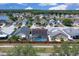 Aerial view showing multiple homes, including one with a screened-in pool, in a residential community at 2049 Shannon Lakes Blvd, Kissimmee, FL 34743