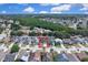 Wide aerial view displaying the home's location in a residential community near a wooded preserve at 2049 Shannon Lakes Blvd, Kissimmee, FL 34743