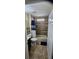 Bathroom featuring a shower with a blue shower curtain, gray tiled wall, and tile flooring at 2049 Shannon Lakes Blvd, Kissimmee, FL 34743
