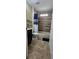 Bathroom showcasing updated tile work in shower and flooring as well as a white bathtub at 2049 Shannon Lakes Blvd, Kissimmee, FL 34743