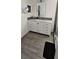 Bathroom featuring a white sink with drawers, granite countertops, and gray tile floors at 2049 Shannon Lakes Blvd, Kissimmee, FL 34743