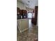 Open kitchen features stainless steel appliances, dark countertops, vaulted ceilings, and wood cabinets at 2049 Shannon Lakes Blvd, Kissimmee, FL 34743
