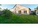 Manicured backyard featuring a well-maintained lawn and mature landscaping at 2110 Korat Ln, Maitland, FL 32751